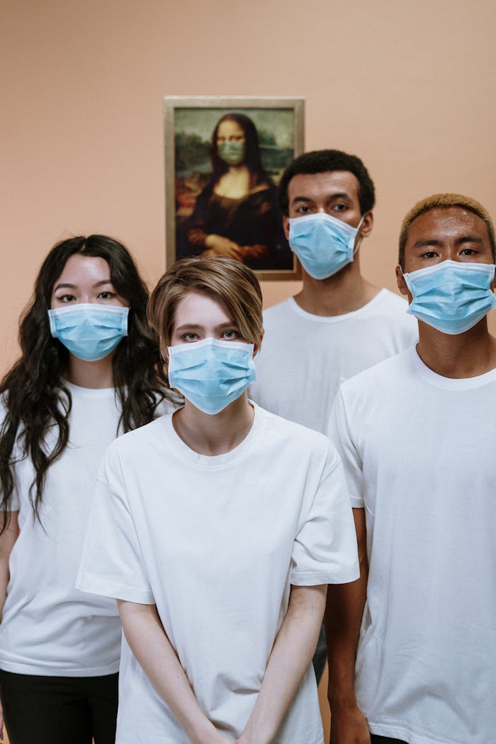Group of healthcare professionals wearing masks in front of Mona Lisa painting for COVID-19 awareness.